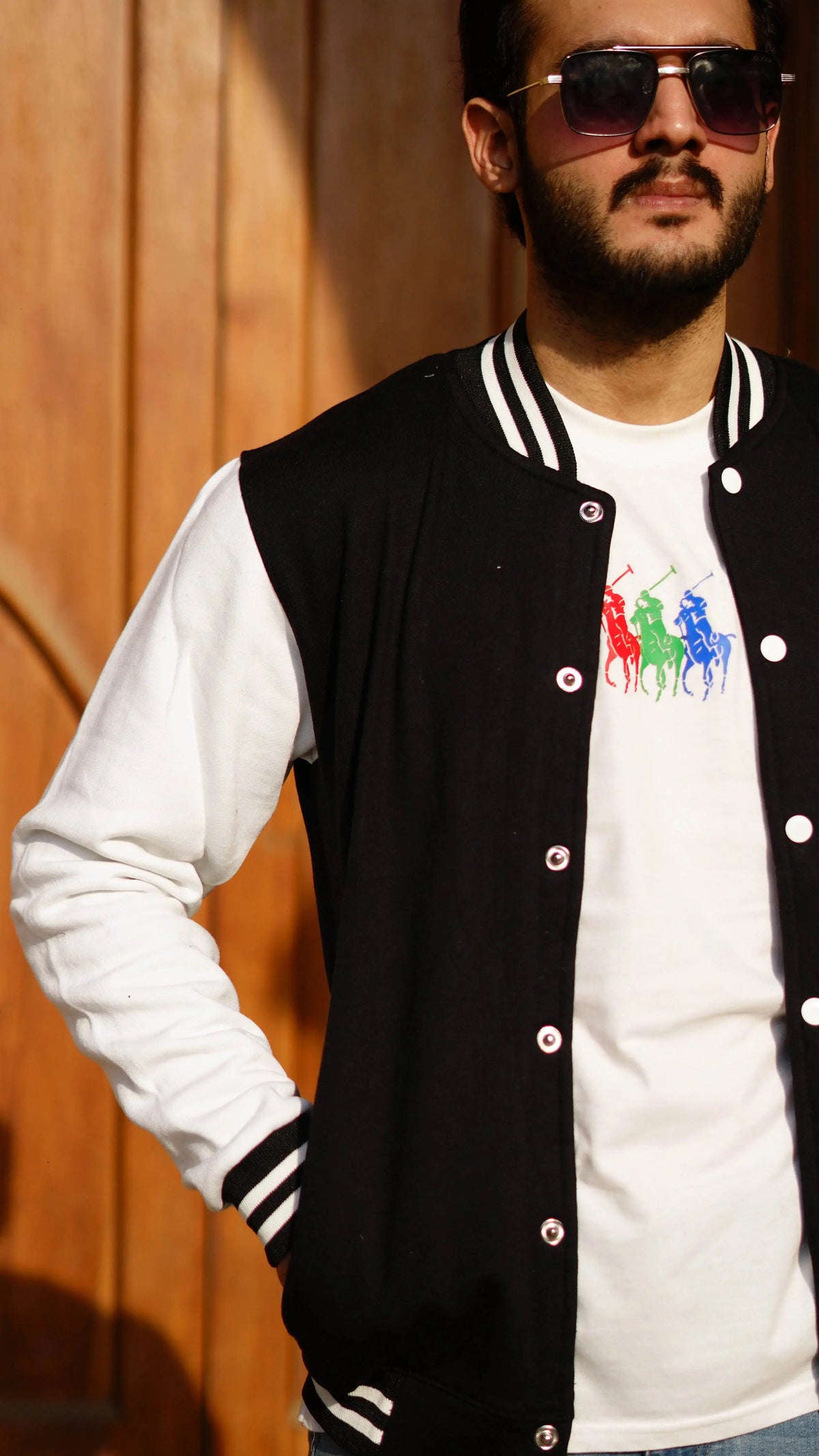 Black and white baseball varsity jacket, model showing collar and chest detail — The Divine Shop